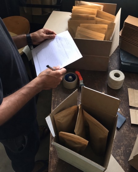 Coffee brand founder preparing customer orders