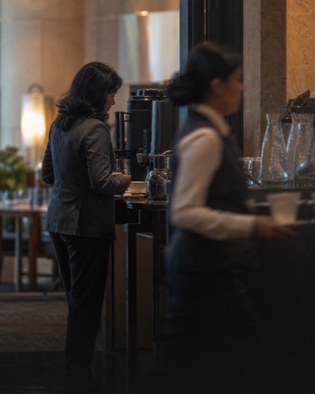 Hotel manager checking a coffee station
