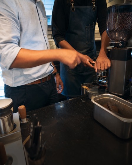 Restaurant operator reviewing coffee service